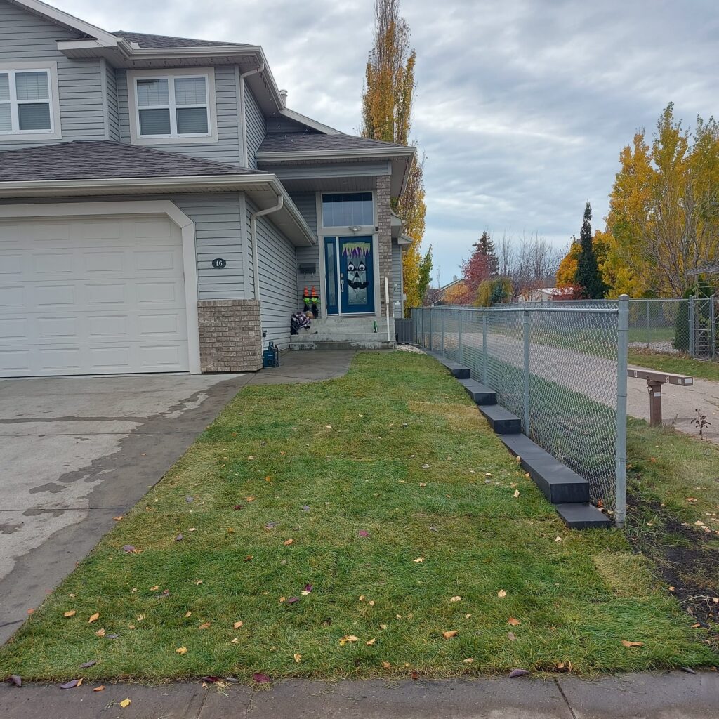 Sod installation beside a home