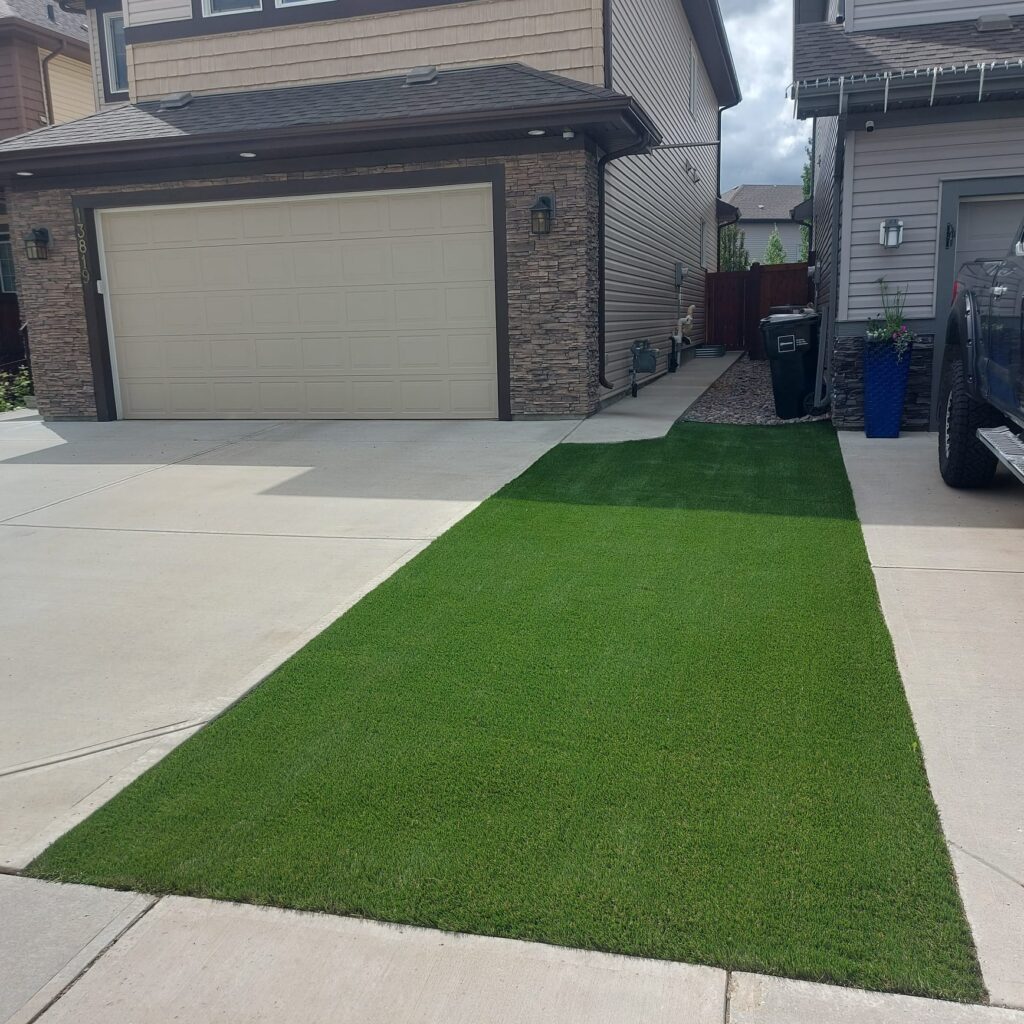 Artificial turf beside garage